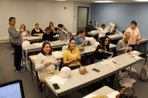 Pictured: SSC English as a Second Language Students make Mats for the Homeless