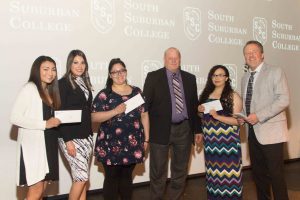 Illiana Financial Credit Union scholarship recipients Lilly Martlink, Ivonne Hernandez, and Elizabeth Cervantes pictured with Illiana representatives.