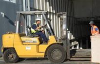 Photo of a man operating a forklift