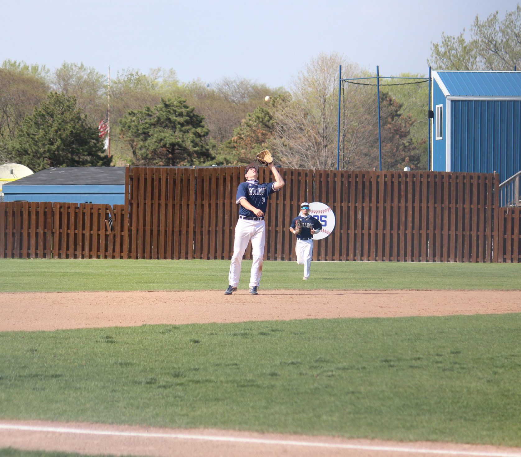 Shortstop catches fly ball South Suburban College