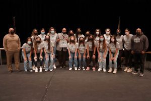 The South Suburban College women’s soccer program gifts Board Chairman Terry Wells with an NJCAA DII Championship t-shirt.