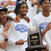 Thumbnail photo of players holding the NJCAA trophy