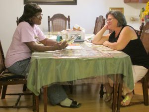 A student and tutor work on a reading activity.