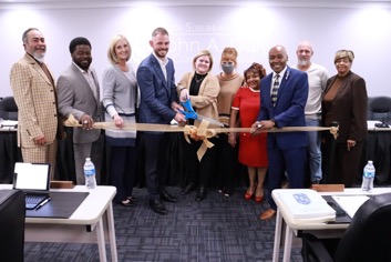 A photo of South Suburban College Board members dedicating a conference room at Oak Forest Campus to former Board Trustee John A. Daly Sr.