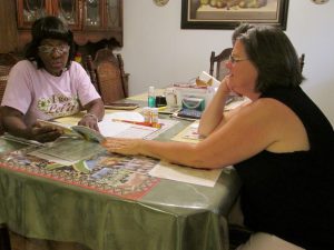 A photo of a tutor and a student as part of the Adult Volunteer Literacy Tutoring Program.