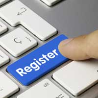 A finger clicking a keyboard button that says, "Register".