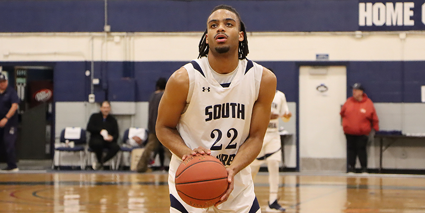 Action shot during a 2025 men's basketball game.