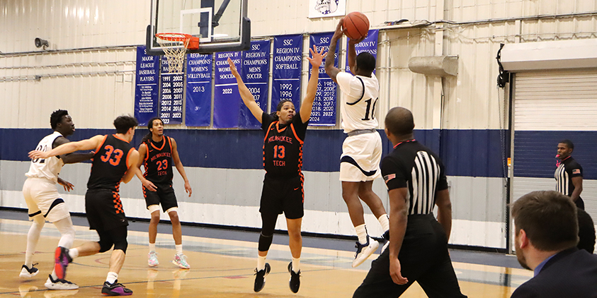 Action shot during a 2025 men's basketball game.