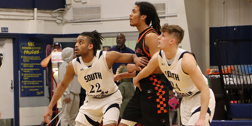 Action shot during a 2025 men's basketball game.