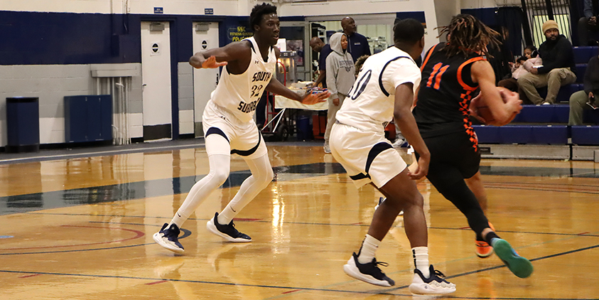 Action shot during a 2025 men's basketball game.