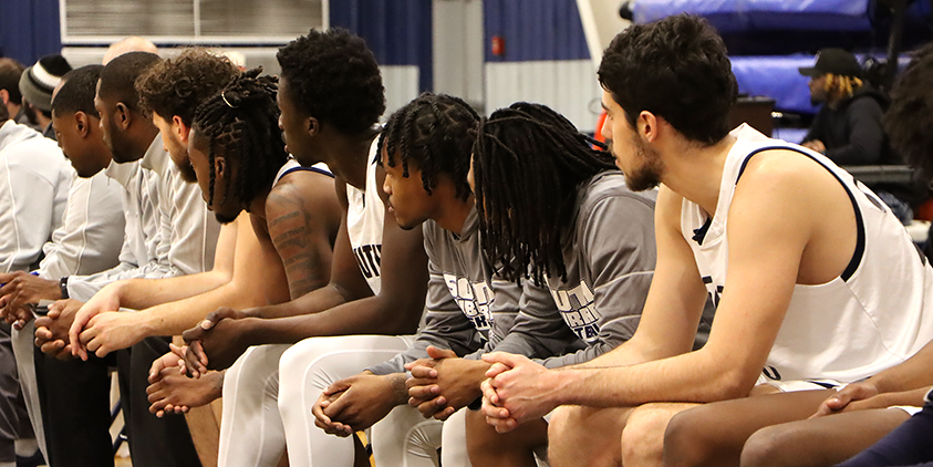 Action shot during a 2025 men's basketball game.