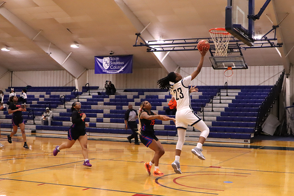 Action shot during a 2025 women's basketball game.