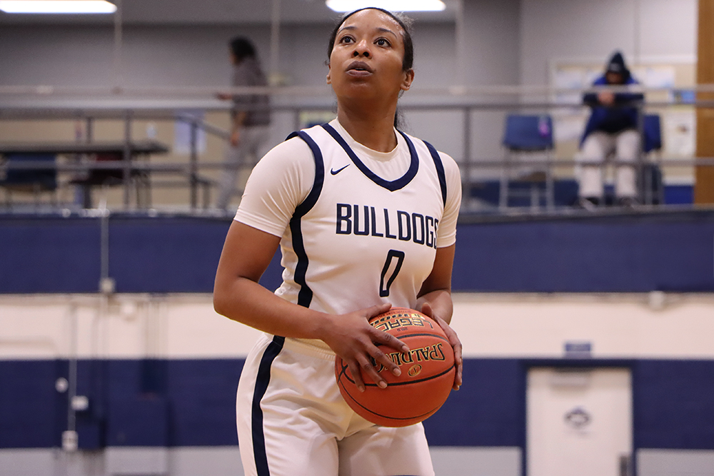 Action shot during a 2025 women's basketball game.