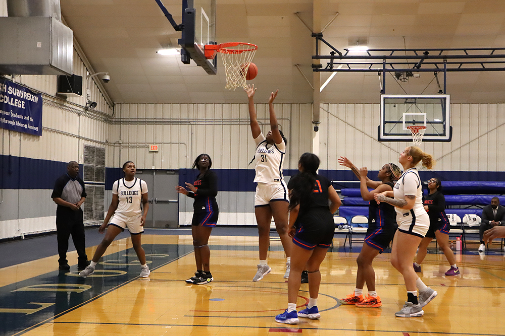 Action shot during a 2025 women's basketball game.