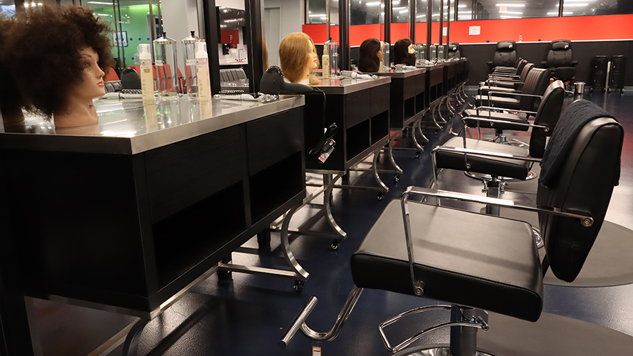 Interior of Cosmetology Program facility (hair cutting stations)