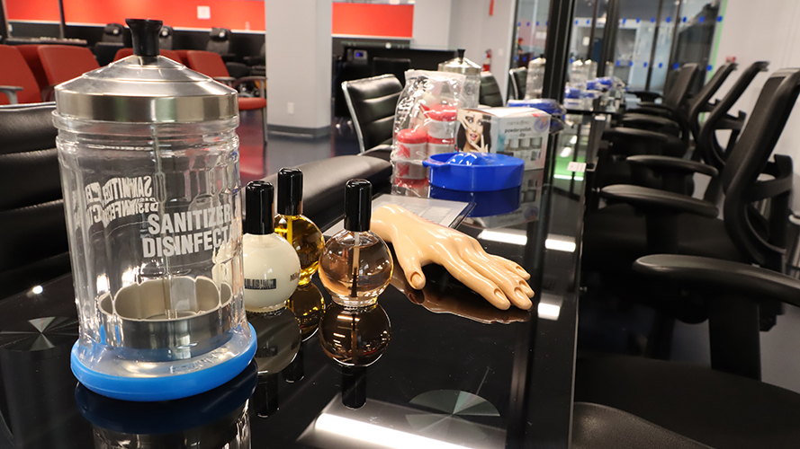 Interior of Cosmetology Program facility (manicure stations)