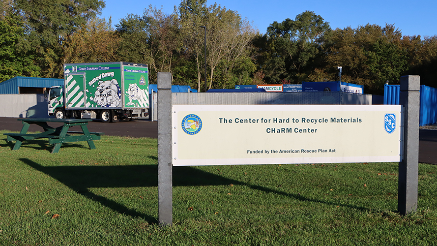 Shred Dawg Truck behind CHaRM Signage