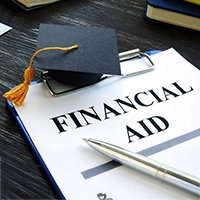 A photo of the words "Financial Aid" on a clip board.