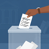 Hand placing a ballot into a box