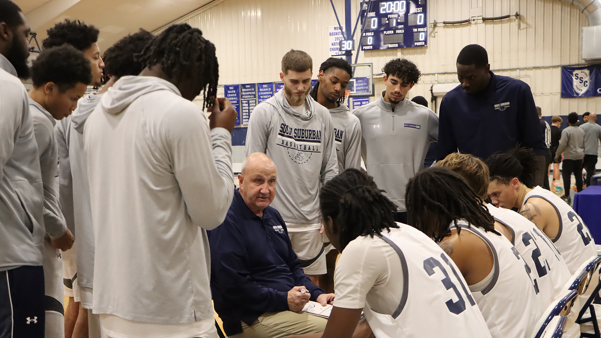 Members of the 2025-2026 Men’s Basketball team gather for a pre-game huddle, making final preparations before taking the court.